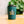 Emerald coffee cup with 'Ocean Grind' logo on a blurred natural background